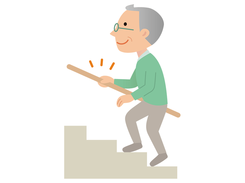 手すりを使って階段を歩く高齢者